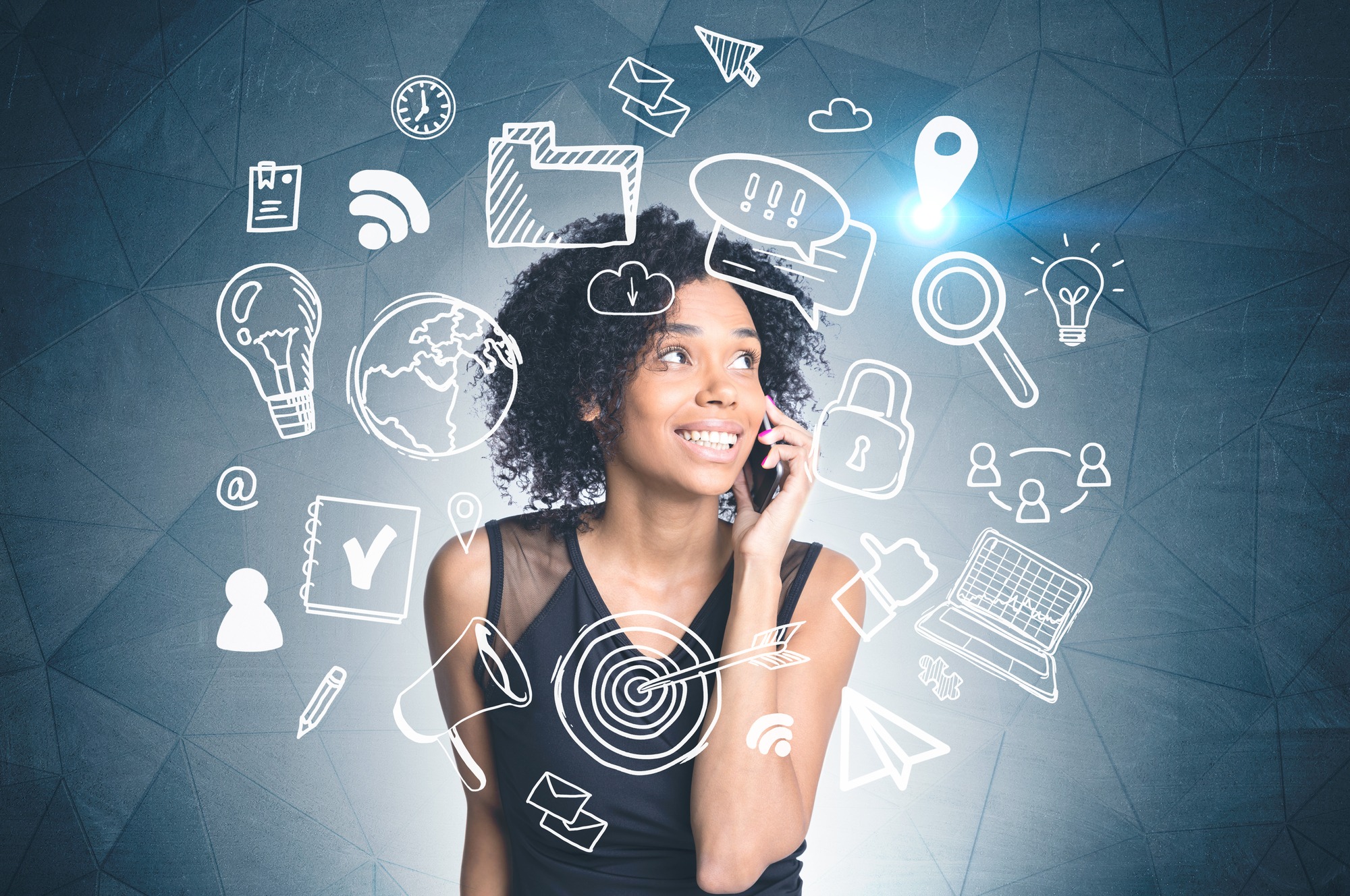 Smiling african american woman talking on phone standing near dark gray wall with white computer and internet drawing. Toned image double exposure